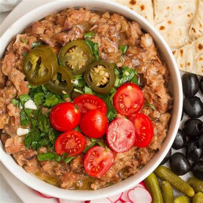  Ful Medames:  A Symphony of Creamy Beans and Zesty Spices Awakens Your Palate!